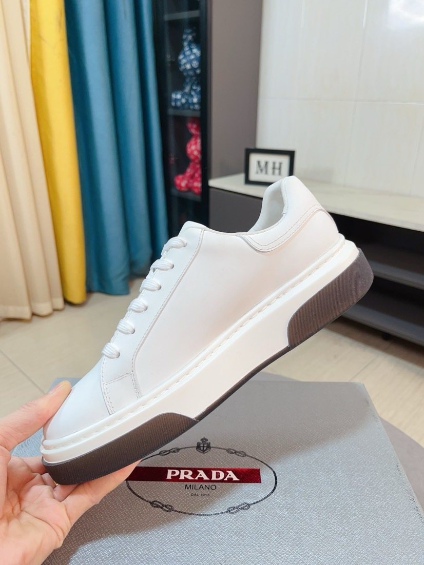 Prada Triangle Patch Low-Top Sneakers — model